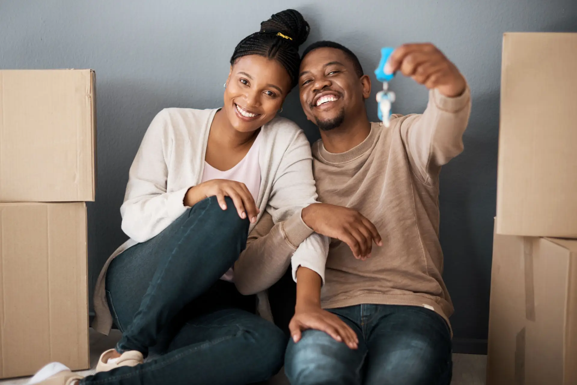 First-time homebuyers celebrating their purchase